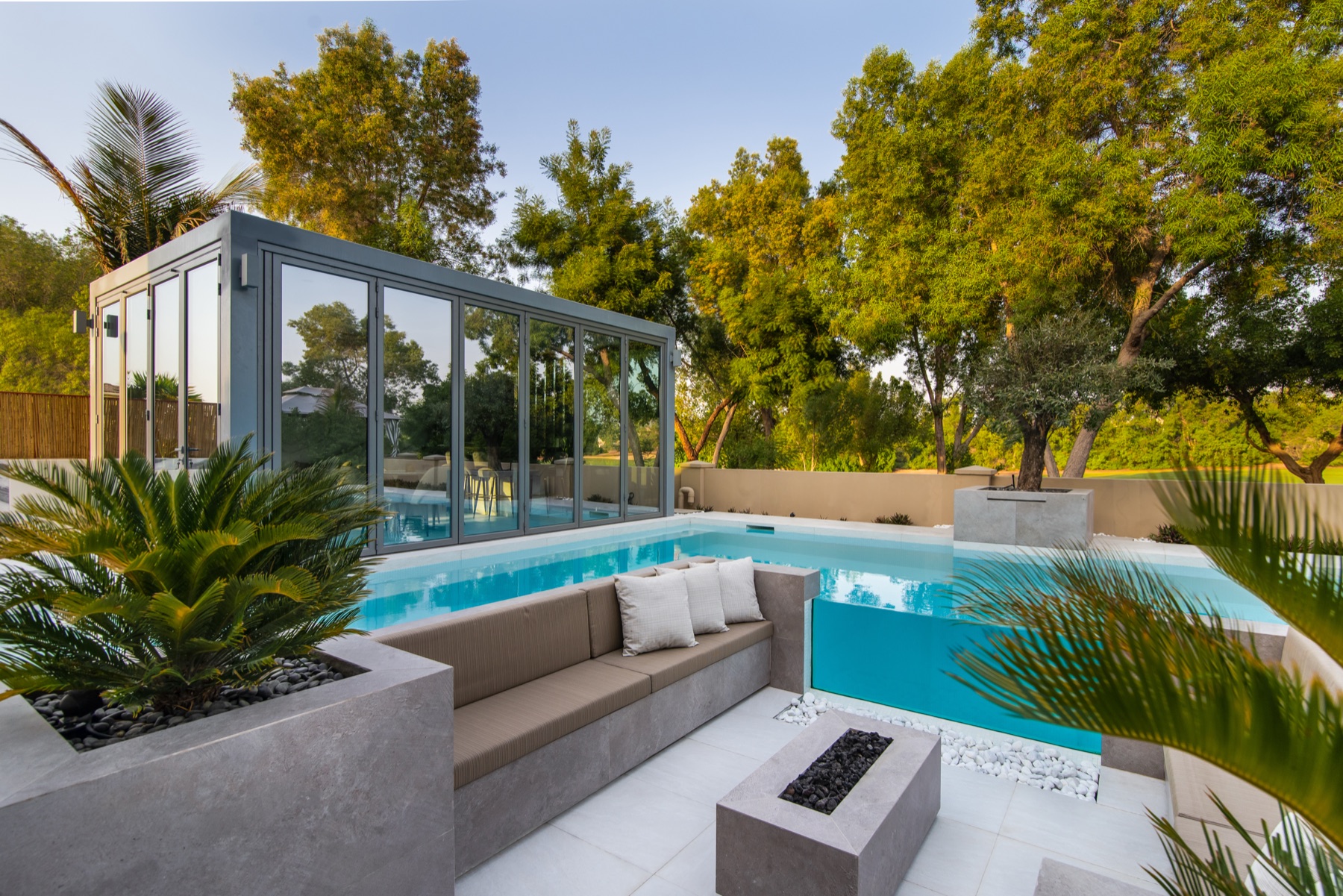Bright daytime completed villa pool and garden handover